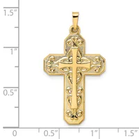 Gold-colored cross pendant with ornate filigree detailing and a smaller cross cutout in the center, shown next to a ruler measuring approximately 1.25 inches tall.