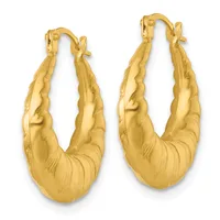 Pair of gold hoop earrings with a textured, twisted surface and a chunky curved design, shown against a white background.