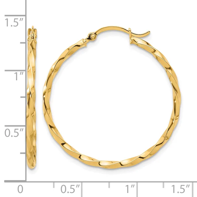 Gold twisted hoop earrings with hinged posts, displayed against a measurement scale showing approximately 1.5 inches in length.