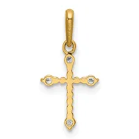 Gold cross pendant with cubic zirconia stones at each end and center, suspended from a gold bail with small hallmark.