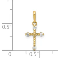 Gold cross pendant with cubic zirconia stones at each cardinal point and center top, shown with a measurement scale indicating approximately half an inch in height.