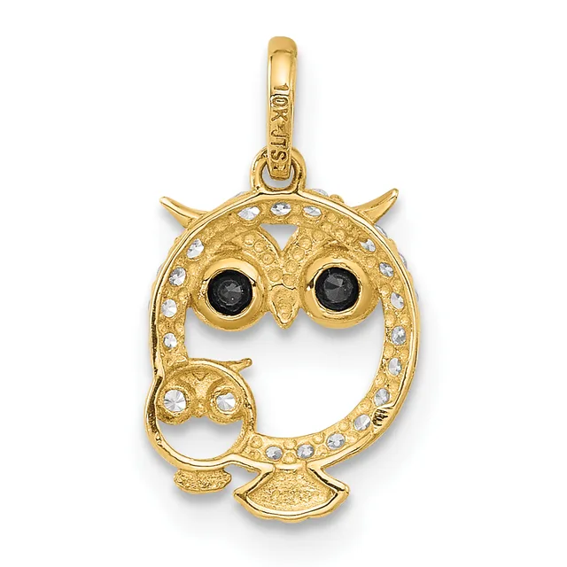 Gold owl pendant with black stone eyes and white crystal accents around the body and wings, suspended from a gold bail.