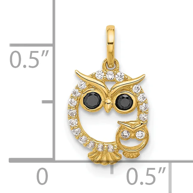 Gold owl pendant with black stone eyes and white cubic zirconia stones set around the body, shown next to a measurement scale indicating approximately 0.5 inches in height.