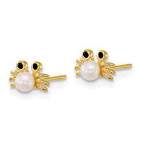 Pair of gold crab-shaped stud earrings with white pearl bodies, black onyx eyes, and post-and-clutch backs.