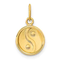 A gold circular pendant featuring a yin-yang symbol hangs from a gold bail loop against a white background.