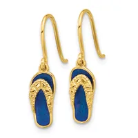 Pair of gold earrings with blue lapis lazuli oval stones set within textured gold frames, suspended from curved gold wires.