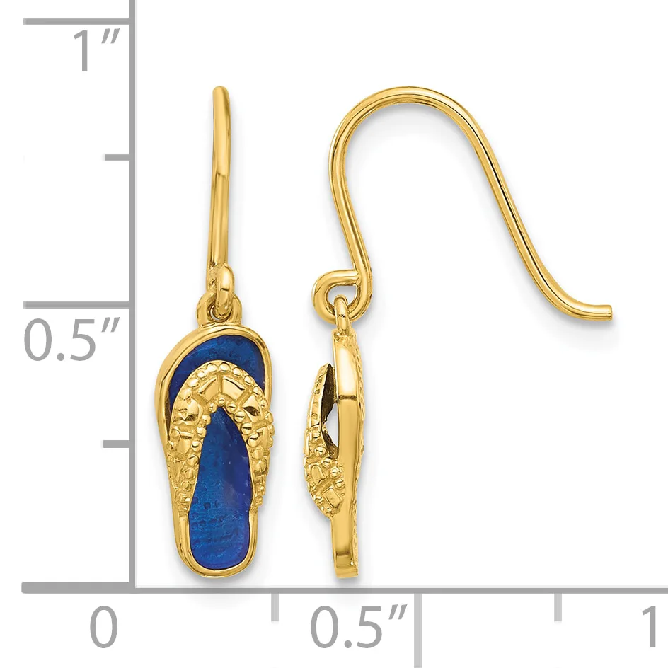 Pair of gold-plated drop earrings with blue lapis lazuli stone centers and textured gold leaf-shaped tops, shown on a measurement scale.