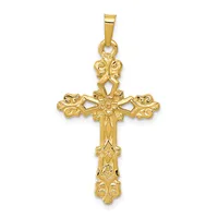A gold ornate cross pendant with decorative filigree details and scrollwork throughout, suspended from a matching gold bail.