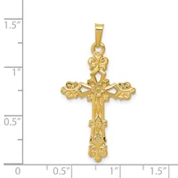 Gold cross pendant with ornate scrollwork and filigree details, shown next to a measurement scale indicating it is approximately one inch wide and one and one-quarter inches tall.