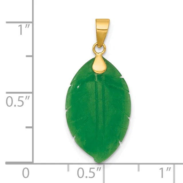 A green jade leaf-shaped pendant with a gold-tone bail, shown next to a ruler indicating it measures approximately one inch in length.