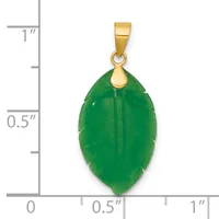A green jade leaf-shaped pendant with a gold-tone bail, shown next to a ruler indicating it measures approximately one inch in length.