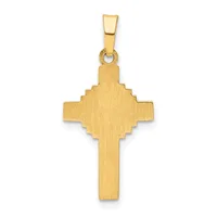 A gold cross pendant with a brushed finish and decorative squared notches at the intersection, suspended from a gold bail.