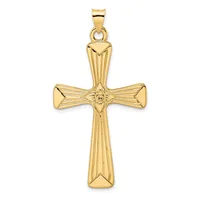 A gold cross pendant with textured vertical striations on the arms and shaft, featuring a small face medallion at the center intersection, displayed against a white background.