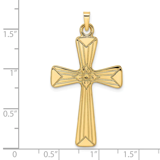 A gold cross pendant with textured vertical lines and decorative floral details at the center, shown against a measurement scale indicating approximately 1.5 inches in height.