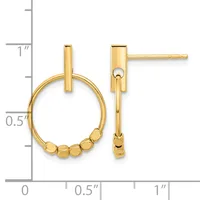 Pair of gold-toned stud earrings with rectangular posts attached to circular hoops decorated with small beads, displayed on a measurement scale.