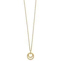 Gold-toned necklace with two nested circular rings pendant hanging from a thin chain against a white background.