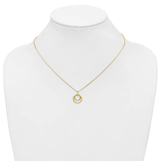 Gold-toned necklace with a delicate chain and a pendant featuring two nested circular rings, displayed on a white mannequin bust.