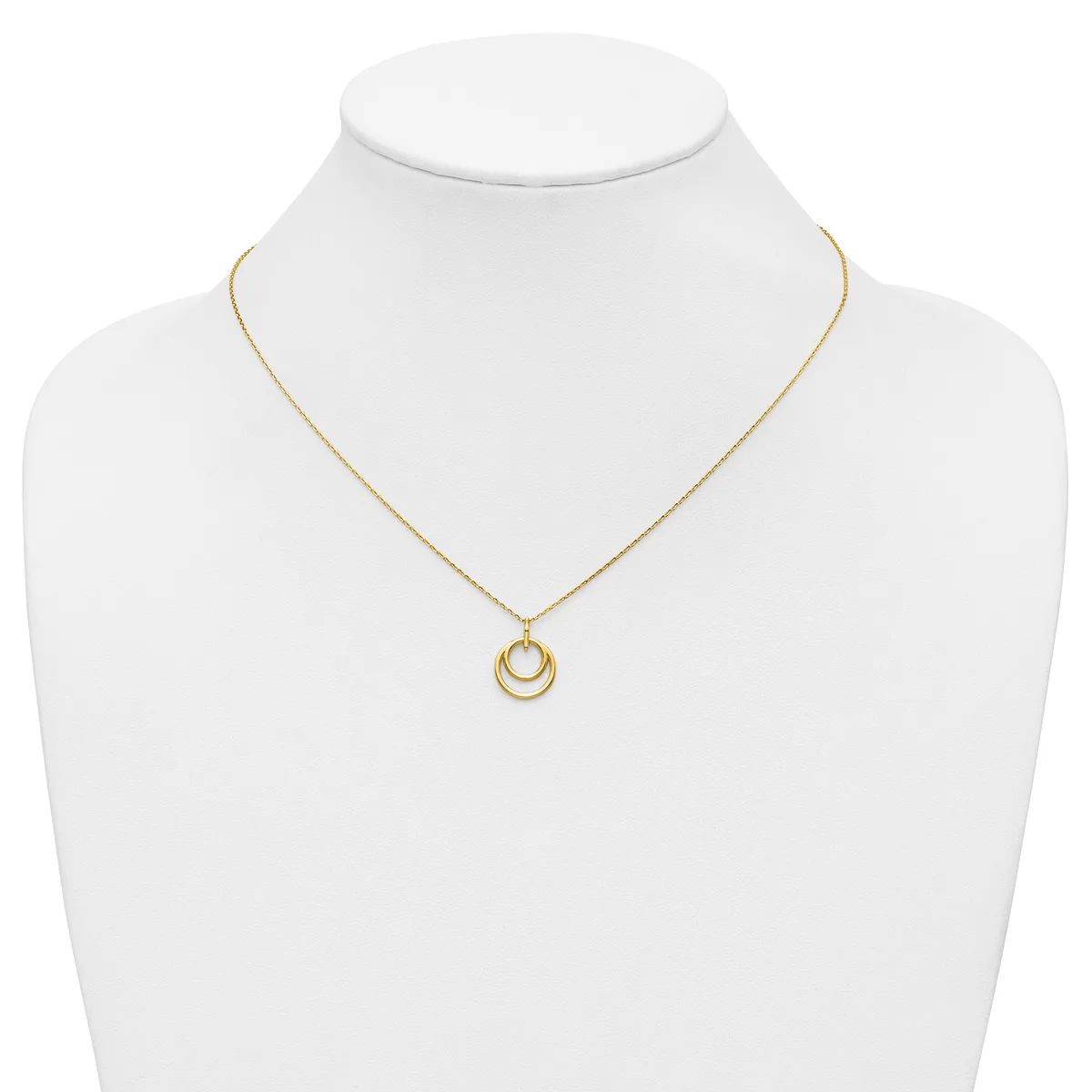Gold-toned necklace with a delicate chain and a pendant featuring two nested circular rings, displayed on a white mannequin bust.