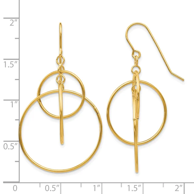Gold-toned drop earrings featuring two nested circles with a vertical bar through the center, displayed against a measurement scale.