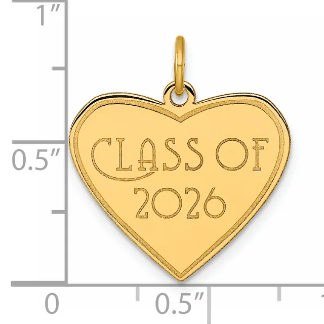 Gold-colored heart-shaped pendant with "CLASS OF 2026" engraved on its surface, shown next to a ruler indicating its size is approximately one inch tall.