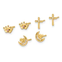 Six gold stud earrings displayed in two rows: two crown-shaped studs with purple stones, two cross-shaped studs with clear stones, and two crescent moon studs with heart centers and clear stones.