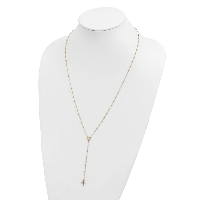 Gold-toned beaded chain necklace with a small cross pendant displayed on a white bust form.