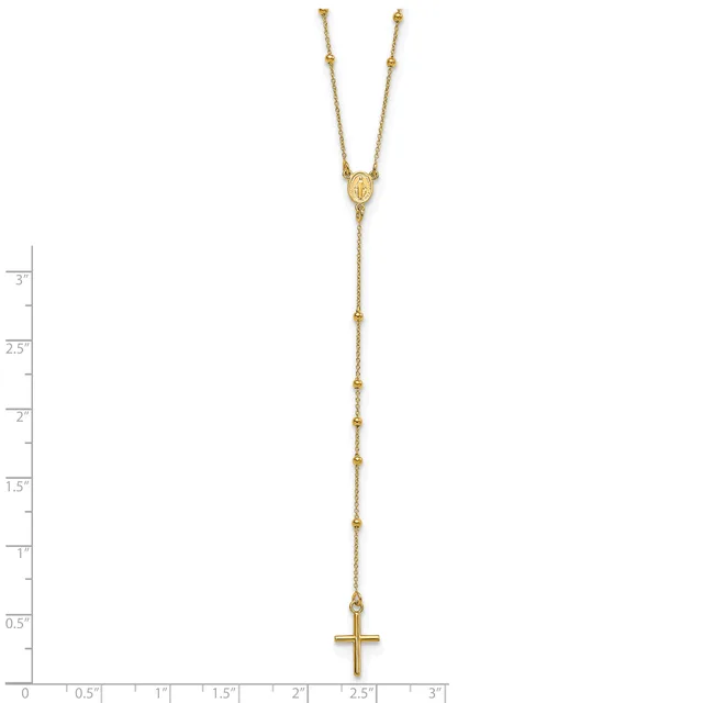 Gold-toned lariat necklace with a small cross pendant at the bottom and decorative beads spaced along the chain, displayed against a white background with a ruler showing measurements up to three inches.