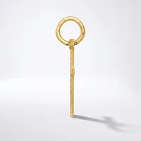 A gold-toned metal key with a circular loop handle at the top and a long rectangular shaft, shown against a white background.