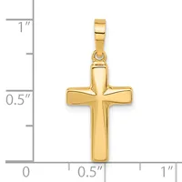 A polished gold cross pendant with a rectangular bail, shown next to a ruler indicating its size is approximately half an inch wide and three-quarters of an inch tall.