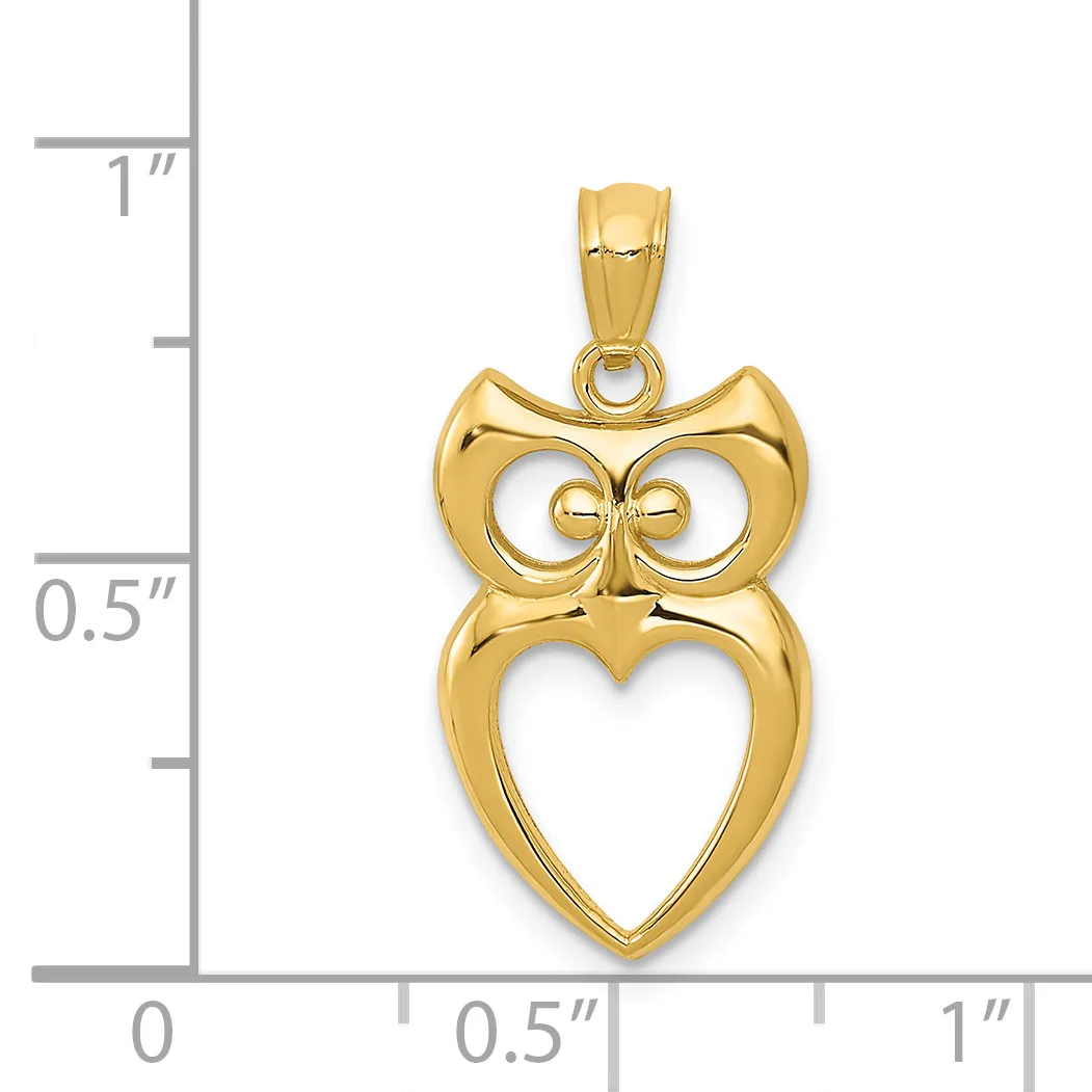 Gold owl pendant with circular eyes and a heart-shaped body, shown next to a ruler measuring approximately 0.75 inches tall.