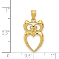 Gold owl pendant with circular eyes and a heart-shaped body, shown next to a ruler measuring approximately 0.75 inches tall.
