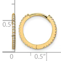 Gold hoop earrings with diamond accents along the outer edge, shown with a measurement scale indicating approximately 0.5 inches in diameter.