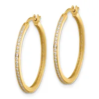 A pair of gold hoop earrings with diamond accents along the outer edge and hinged closures, shown against a white background.