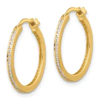 A pair of gold hoop earrings with diamond accents along the outer edges, displayed side by side against a white background.