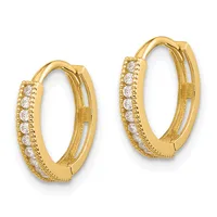 A pair of gold hoop earrings with round cubic zirconia stones set along the front and decorative milgrain detailing on the sides.