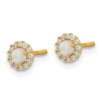 A pair of gold stud earrings with round opal centers surrounded by a halo of small round diamonds, shown from the front.