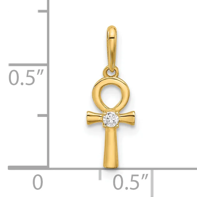 A gold ankh cross pendant with a round diamond set at the crossbar, shown next to a measurement scale indicating approximately half an inch in height.