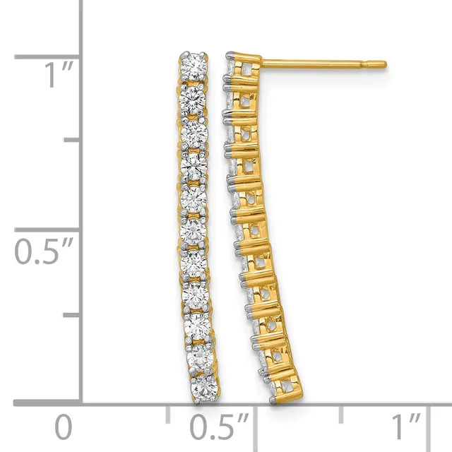 A pair of gold drop earrings with round diamonds set in a vertical line, displayed next to a measurement ruler showing approximately one inch in length.