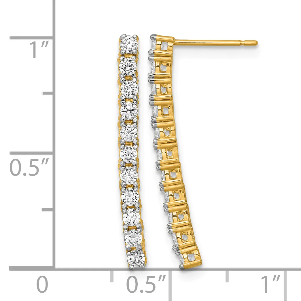 A pair of gold drop earrings with round diamonds set in a vertical line, displayed next to a measurement ruler showing approximately one inch in length.