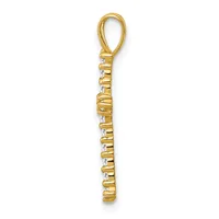 Gold pendant with rectangular baguette-cut diamonds set vertically along the length, topped with a loop bail.