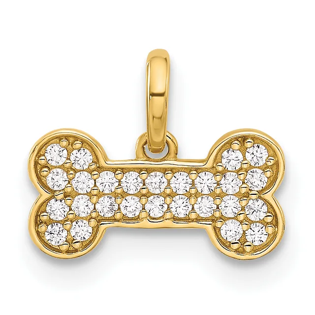 A gold bone-shaped pendant with cubic zirconia stones set throughout, suspended from a gold bail.