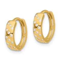 A pair of gold hoop earrings set with round diamonds arranged in a scattered pattern across the surface, shown from the front.