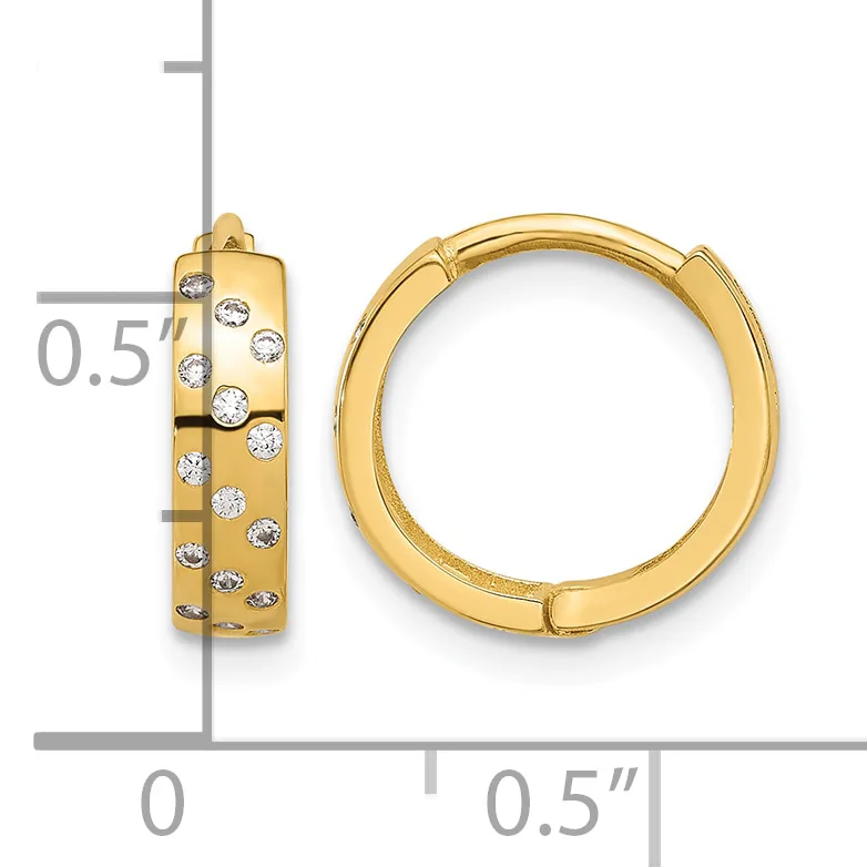 A pair of gold hoop earrings with scattered diamond accents, shown from front and side views next to a measurement scale.