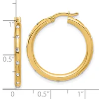 Gold hoop earrings with diamond accents shown from front and side views against a measurement scale.