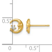 A pair of gold crescent moon stud earrings, each featuring a small round diamond, shown front and side view with a measurement scale indicating approximately half an inch in size.