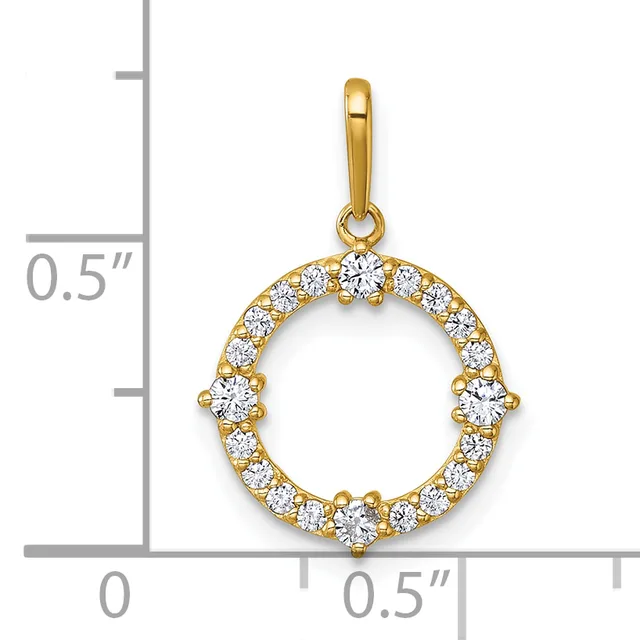 A gold circular pendant with cubic zirconia stones arranged around the rim, shown next to a ruler for scale.