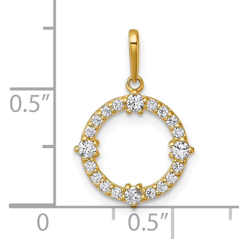 A gold circular pendant with cubic zirconia stones arranged around the rim, shown next to a ruler for scale.