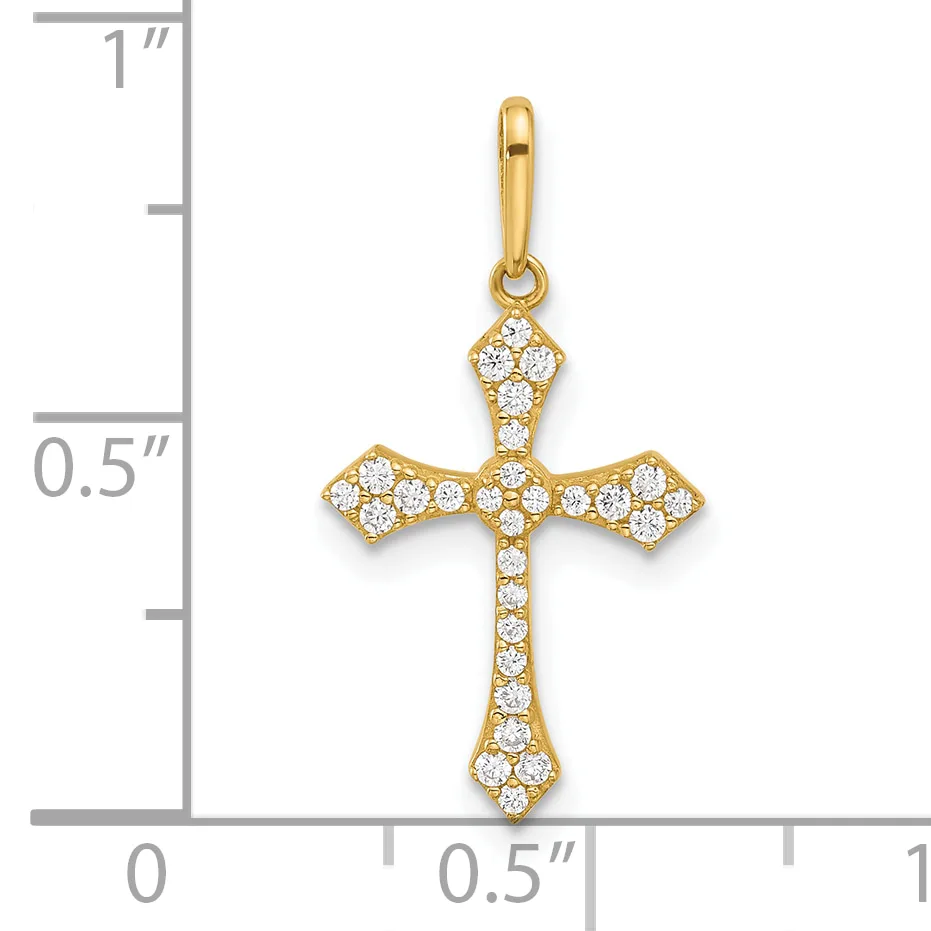 A gold cross pendant with cubic zirconia stones set throughout, displayed next to a ruler showing it measures approximately three-quarters of an inch in height.