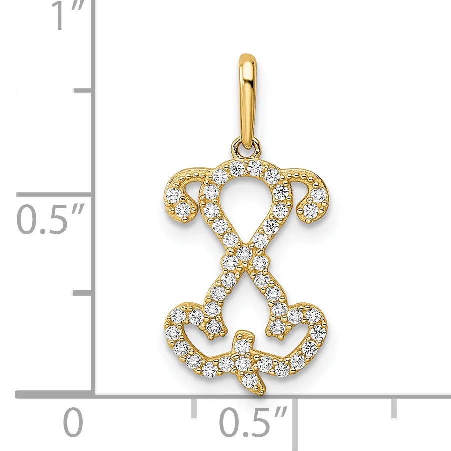 Gold pendant with cubic zirconia stones forming a symmetrical design of curved loops and heart shapes, shown against a measurement scale.