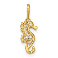 A gold seahorse pendant with cubic zirconia stones set along its body, suspended from a gold bail.
